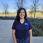 Denise standing outside of the office. 